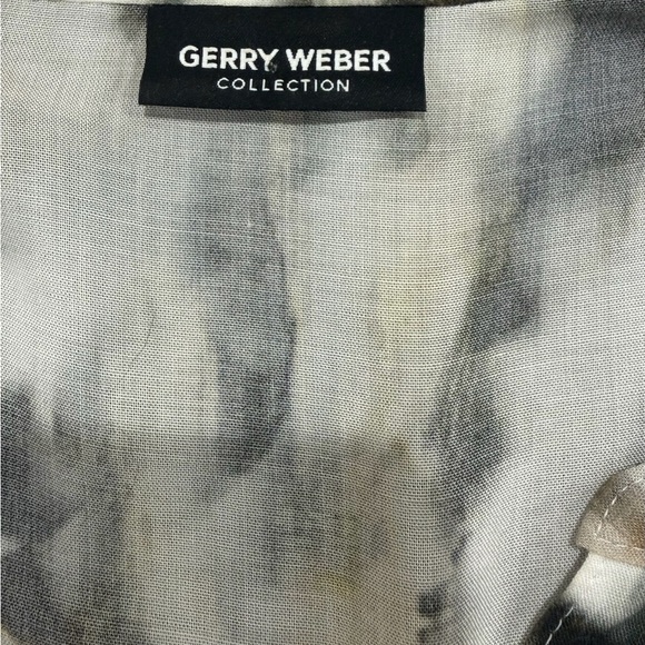 Trendy Women's Abstract Print Blouse with Half Button-Up Front and Roll-Up Tabs - Picture 6 of 6